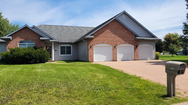 view of front of property with a garage and a front yard