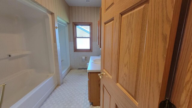 bathroom with tile patterned flooring and vanity