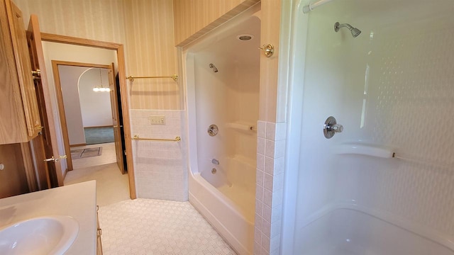 bathroom featuring sink, shower / bathing tub combination, and tile patterned floors