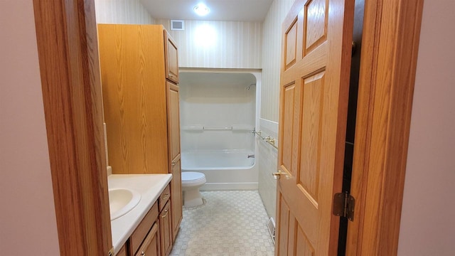 full bathroom with tile patterned flooring, shower / bathing tub combination, toilet, and vanity