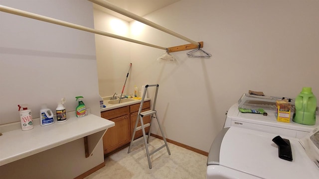 bathroom with washing machine and dryer and vanity