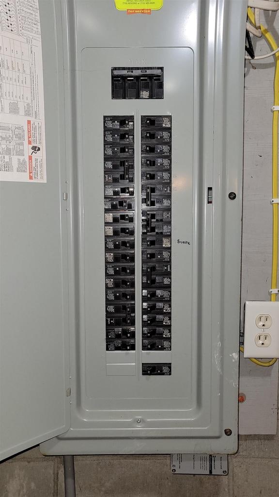 utility room featuring electric panel