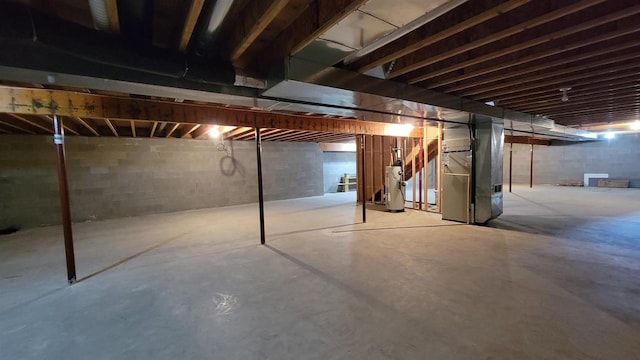 basement with gas water heater and heating unit