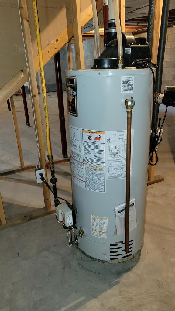 utility room with gas water heater