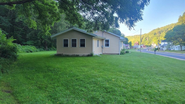 view of home's exterior featuring a lawn