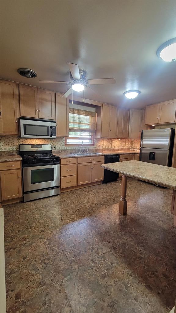 kitchen featuring ceiling fan, tile patterned flooring, light brown cabinetry, appliances with stainless steel finishes, and sink