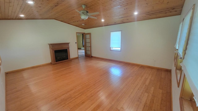 unfurnished living room with a fireplace, light wood-style flooring, vaulted ceiling, wooden ceiling, and baseboards