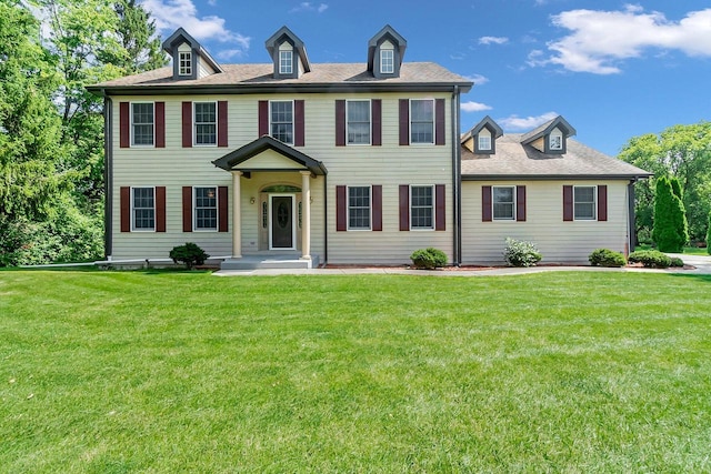 colonial home with a front yard