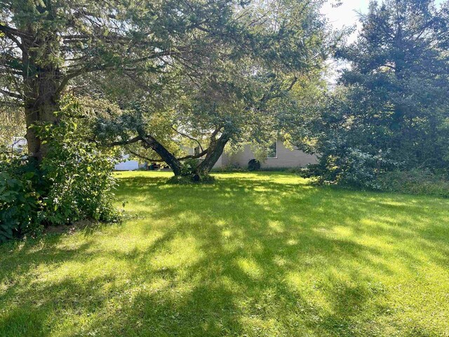 view of front of property with a garage and a front yard