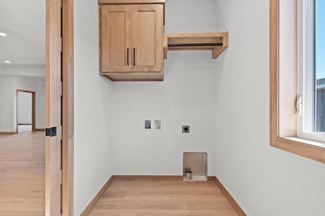 laundry room with hookup for a washing machine, cabinet space, light wood-style flooring, hookup for an electric dryer, and baseboards