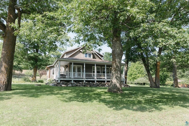 view of front of house with a porch and a front yard