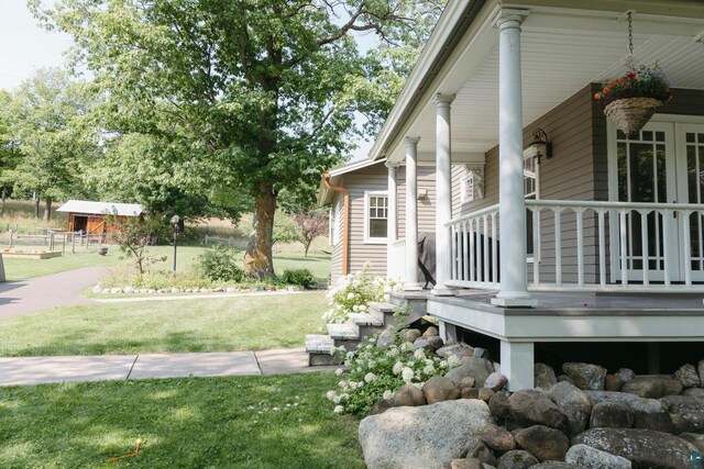 view of side of property with a yard