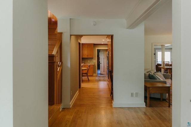 34780 S County Highway J, Bayfield, WI 54814 - hall with light wood-style floors, stairs, baseboards, and beam ceiling