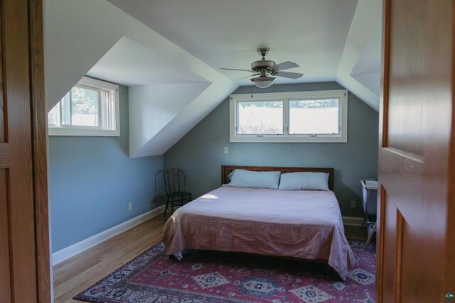 34780 S County Highway J, Bayfield, WI 54814 - bedroom with light wood-type flooring, baseboards, a ceiling fan, and lofted ceiling