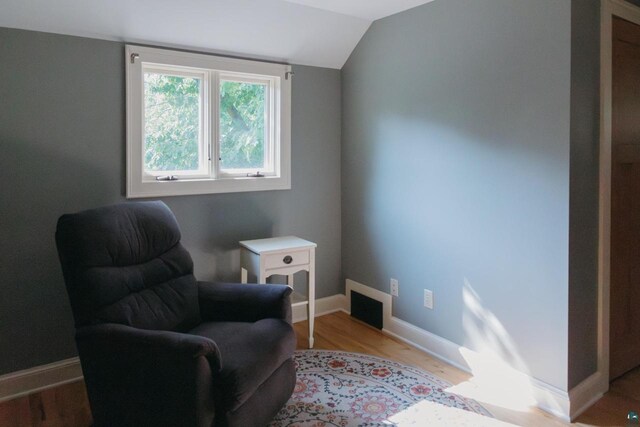 sitting room featuring light hardwood / wood-style flooring and vaulted ceiling