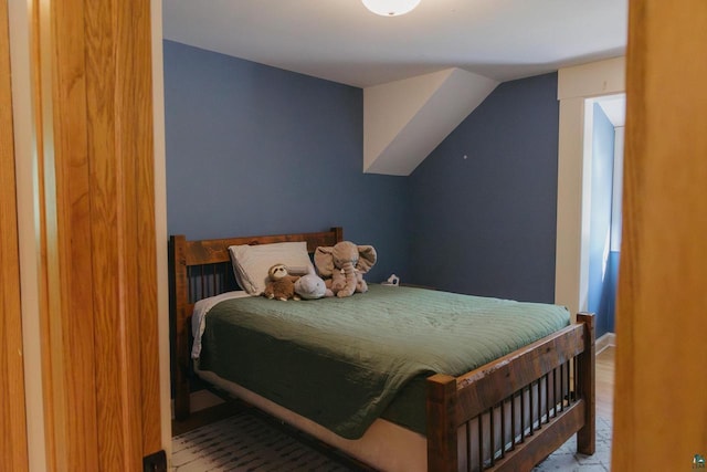 34780 S County Highway J, Bayfield, WI 54814 - bedroom with light wood-style flooring and vaulted ceiling