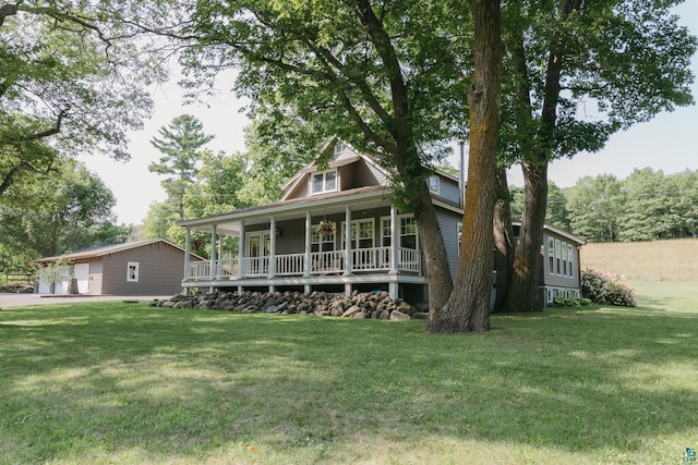 view of front facade with a front lawn and covered porch