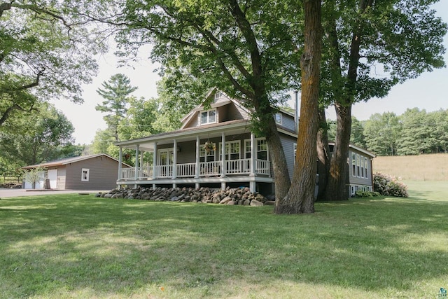 34780 S County Highway J, Bayfield, WI 54814 - country-style home featuring covered porch, a front lawn, and a garage