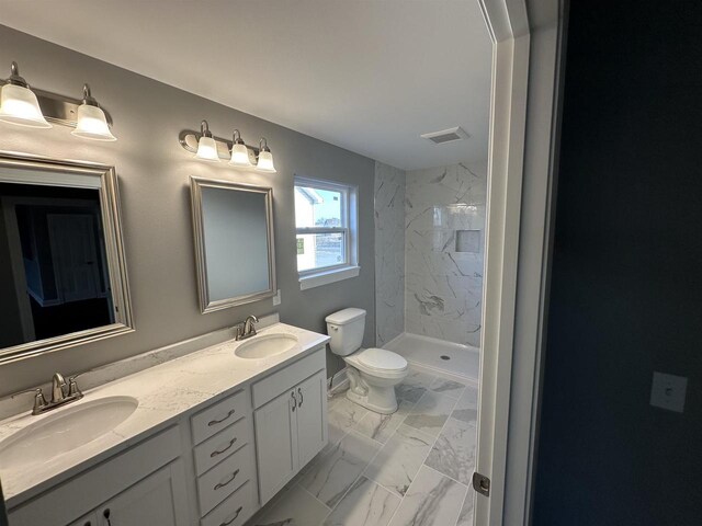 bathroom featuring toilet, tile patterned flooring, and vanity