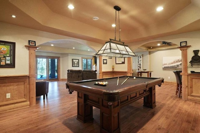 recreation room featuring hardwood / wood-style flooring, billiards, and a raised ceiling