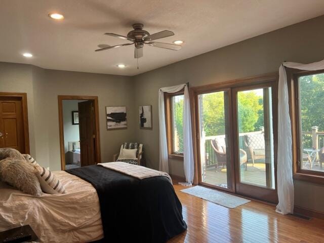 bedroom with light hardwood / wood-style floors, ceiling fan, and access to exterior