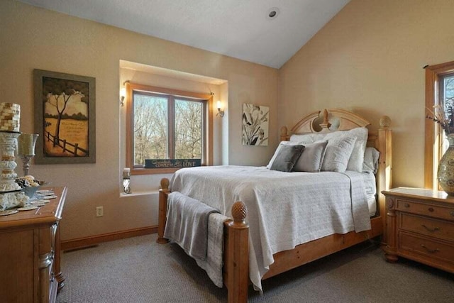 carpeted bedroom with lofted ceiling