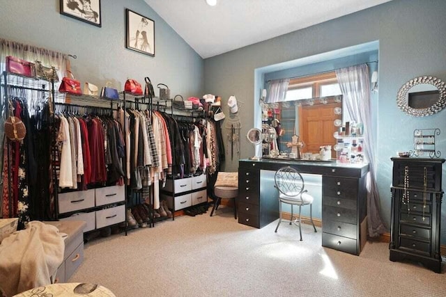 spacious closet with carpet floors and lofted ceiling