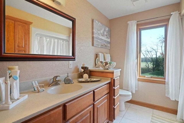 bathroom with tile patterned floors, toilet, and vanity