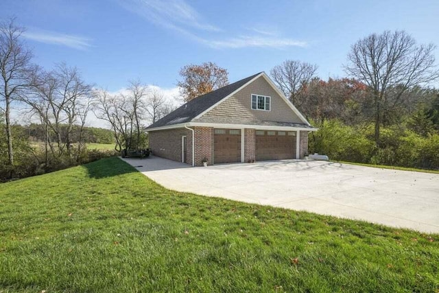 view of home's exterior featuring a garage and a yard