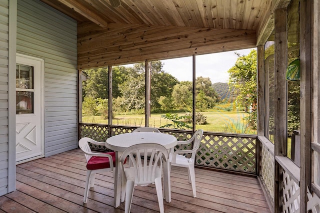 sunroom / solarium with lofted ceiling and wooden ceiling