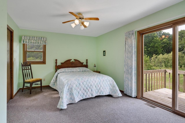 bedroom featuring access to exterior, visible vents, baseboards, carpet, and a ceiling fan