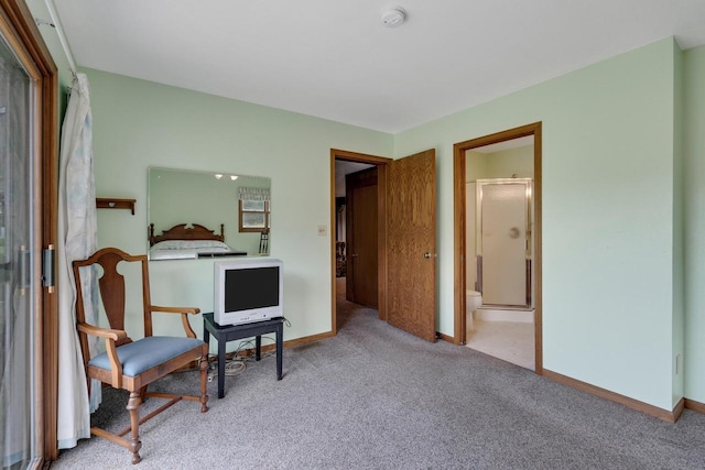 sitting room featuring carpet flooring and baseboards