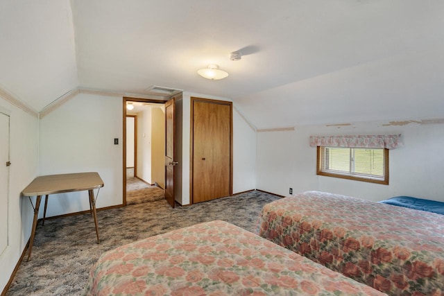 bedroom featuring vaulted ceiling, carpet flooring, and baseboards