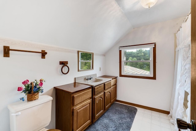 full bath with tile patterned floors, baseboards, lofted ceiling, and a wealth of natural light