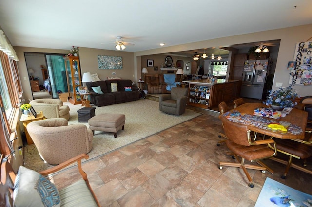 living room featuring a ceiling fan