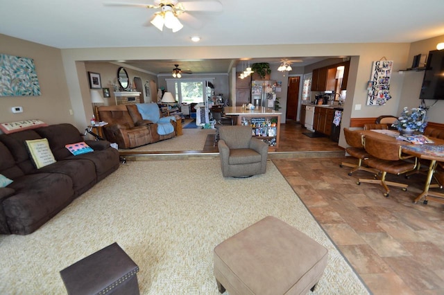 living area featuring ceiling fan