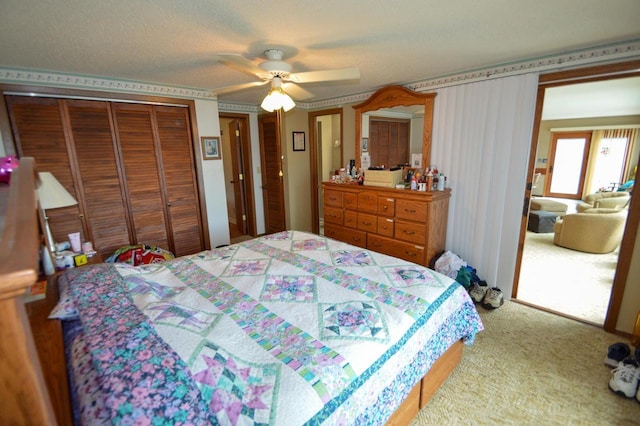 bedroom featuring ceiling fan, carpet floors, and a closet