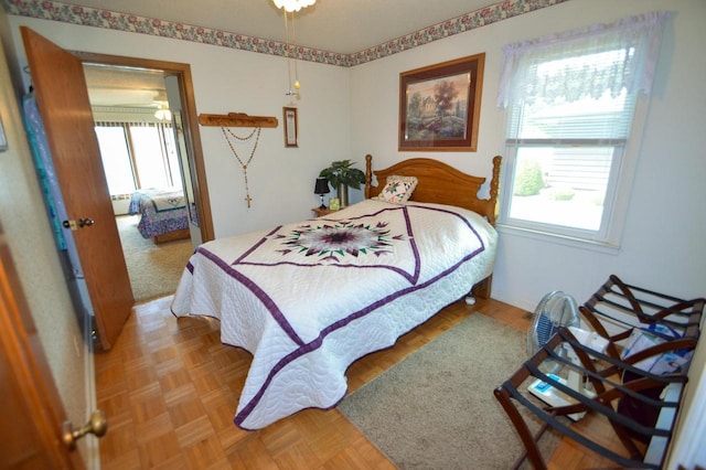 bedroom featuring multiple windows