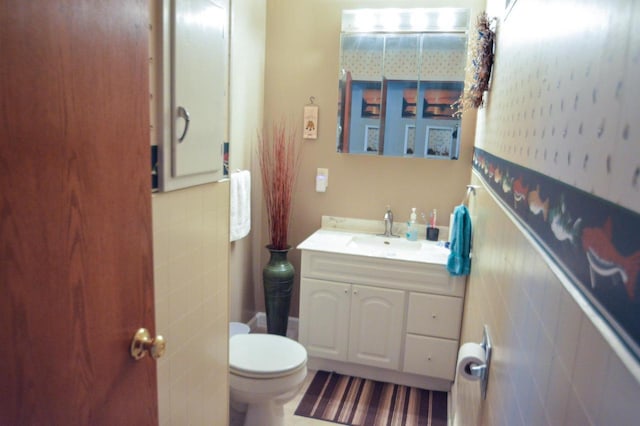 bathroom featuring toilet and vanity