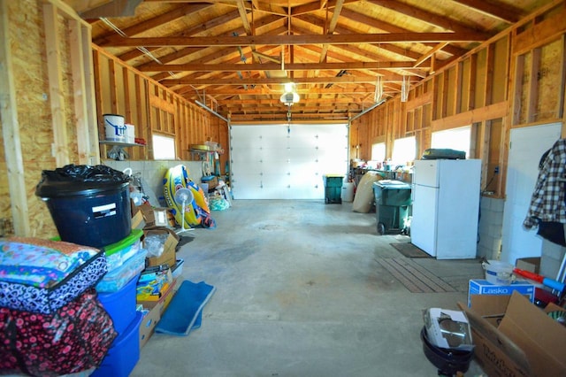 garage with freestanding refrigerator