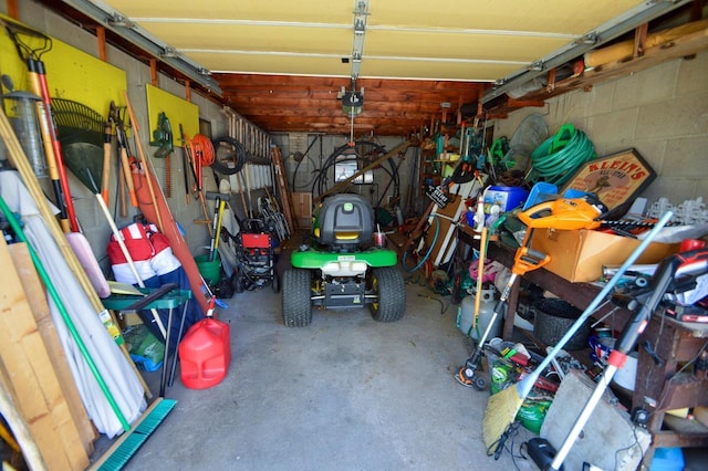 garage with concrete block wall