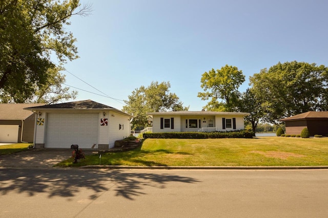 ranch-style house featuring driveway and a front lawn