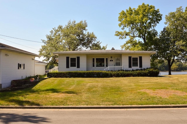 single story home featuring a front lawn