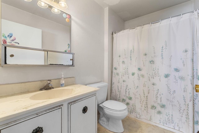 bathroom with toilet and vanity