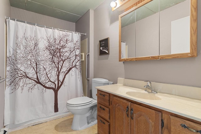 bathroom featuring toilet, vanity, and a shower with curtain