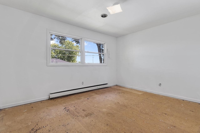 unfurnished room featuring baseboard heating