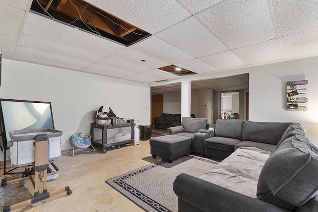 living room with a drop ceiling