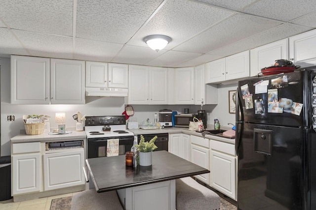 kitchen featuring white cabinetry, light tile patterned flooring, a paneled ceiling, and black appliances