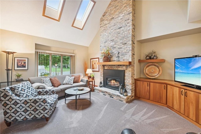 carpeted living room featuring a fireplace, a skylight, and high vaulted ceiling