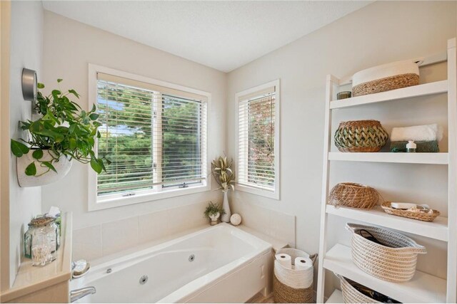 bathroom featuring a tub to relax in